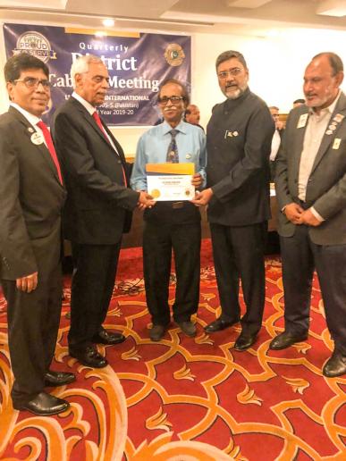 RECEIVING LIONS CLUBS INTERNATIONAL PRESIDENT'S CERTIFICATE OF EXCELLENCE